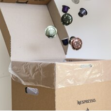 Capsules being emptied into the bulk recycling box