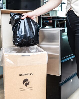 In-home capsules being recycled in the Nespresso bulk recycling box