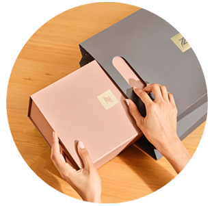 Woman unwrapping a Nespresso delivery box