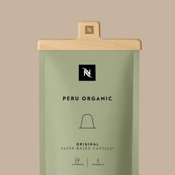 Zak met Home Compostable capsules gesloten met de Nespresso-klem